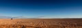 Panoramic wide banner landscape view near Ã¢â¬ÅOjos del SalarÃ¢â¬Â in Atacama Desert, Chile. Tire tracks contrasting the wilderness